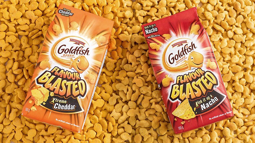 Goldfish® Flavour Blasted Xtreme Cheddar and Kick it up a Nacho packages on top of Goldfish crackers